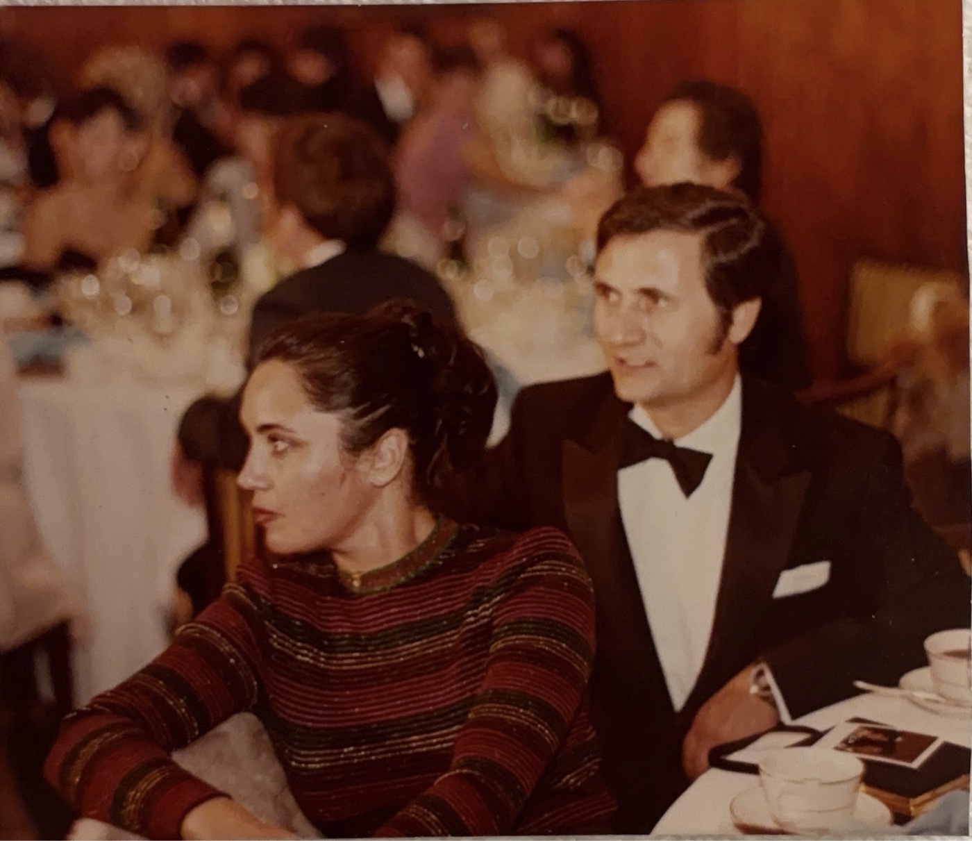 Elena and Mike seated together at a formal evening gala